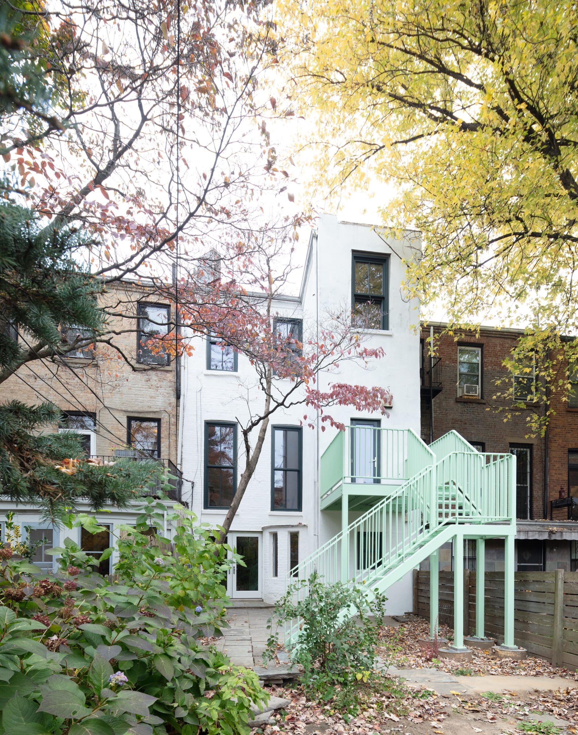 REAR FACADE WITH PALE GREEN STAIR TO GARDEN