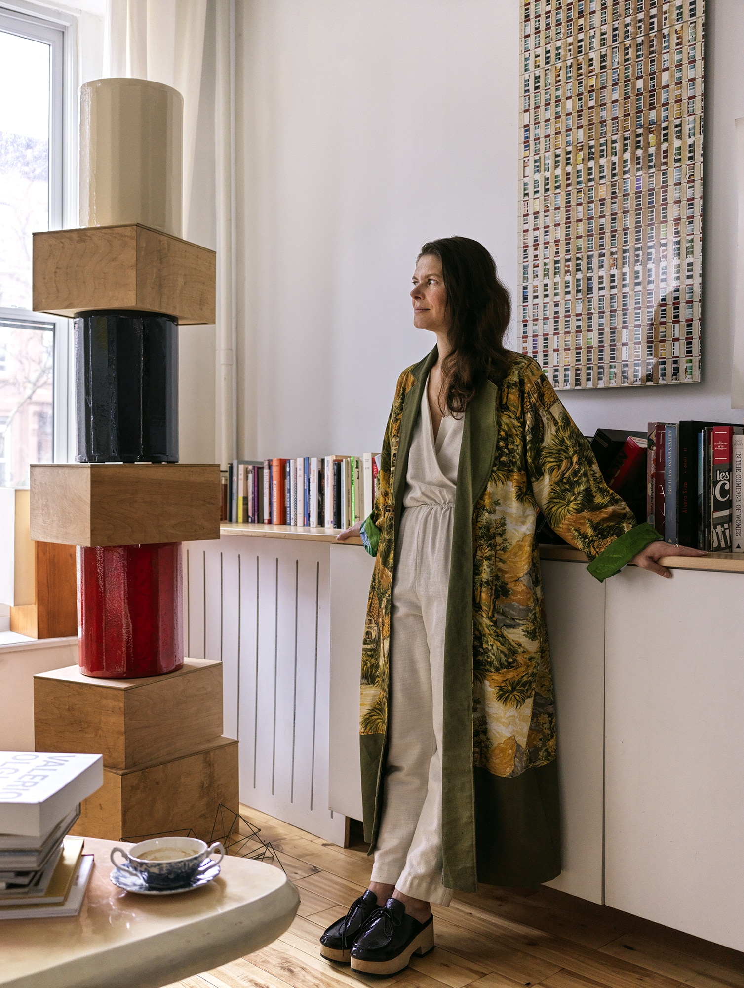 CRINA NEXT TO TOWER SCULPTURE