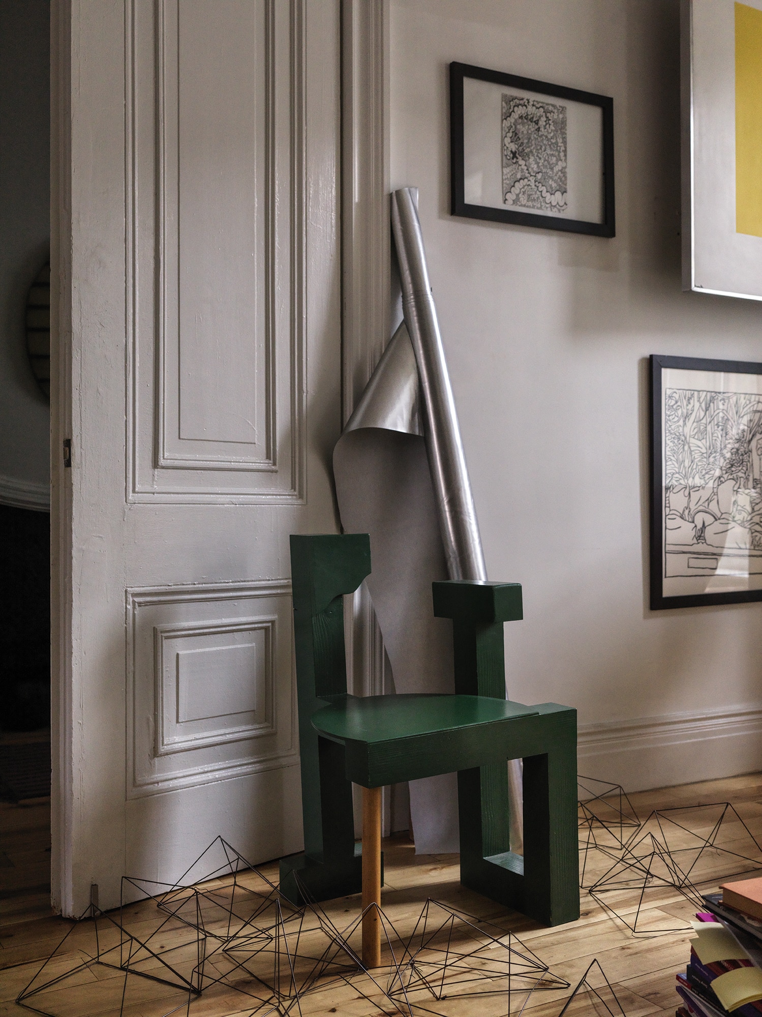 DOOR WITH MOLDING AND GREEN CHAIR