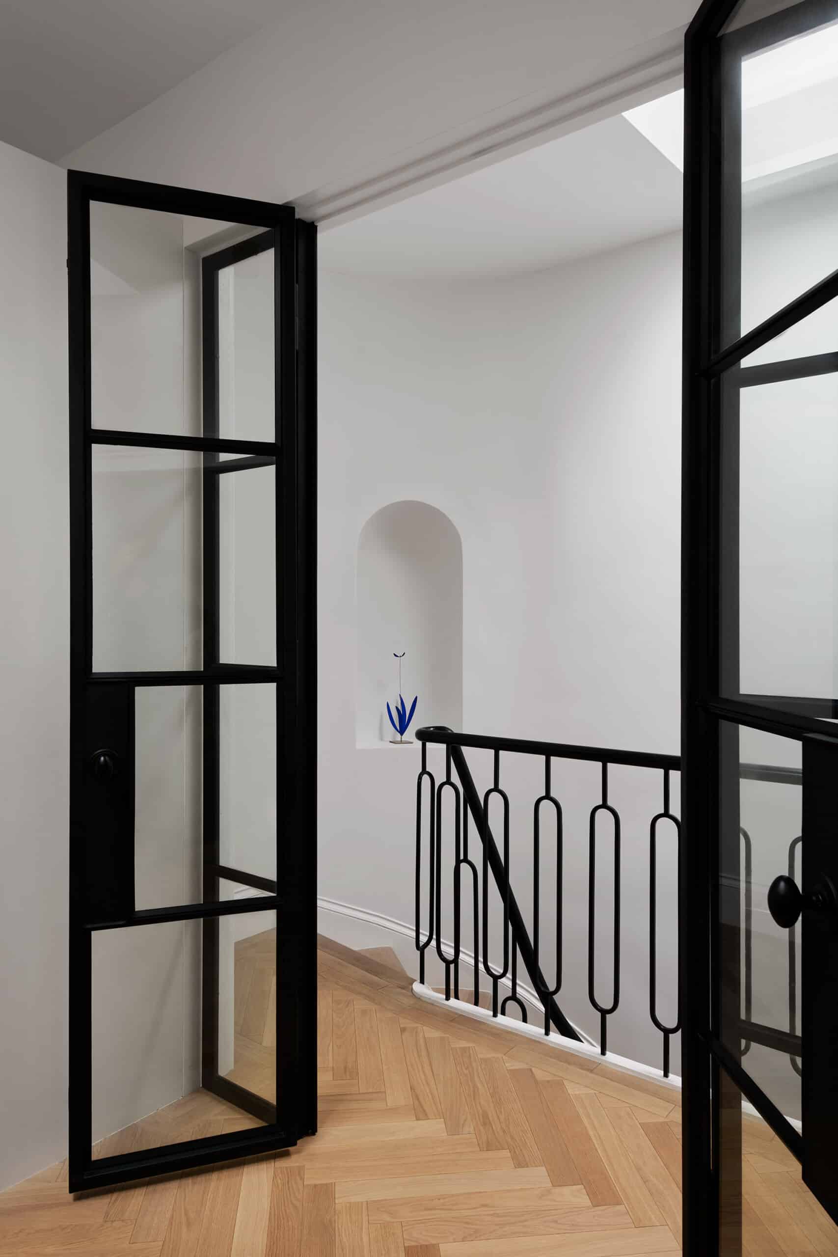 HALLWAY AND GLASS DOORS INTO BATH