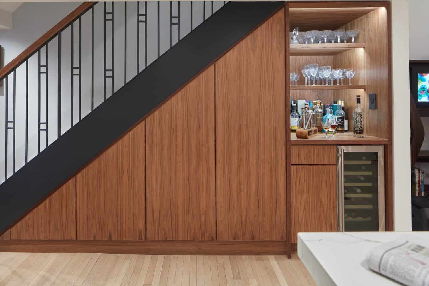 KITCHEN - built-in storage on the stair wall and a drink station with wine fridge