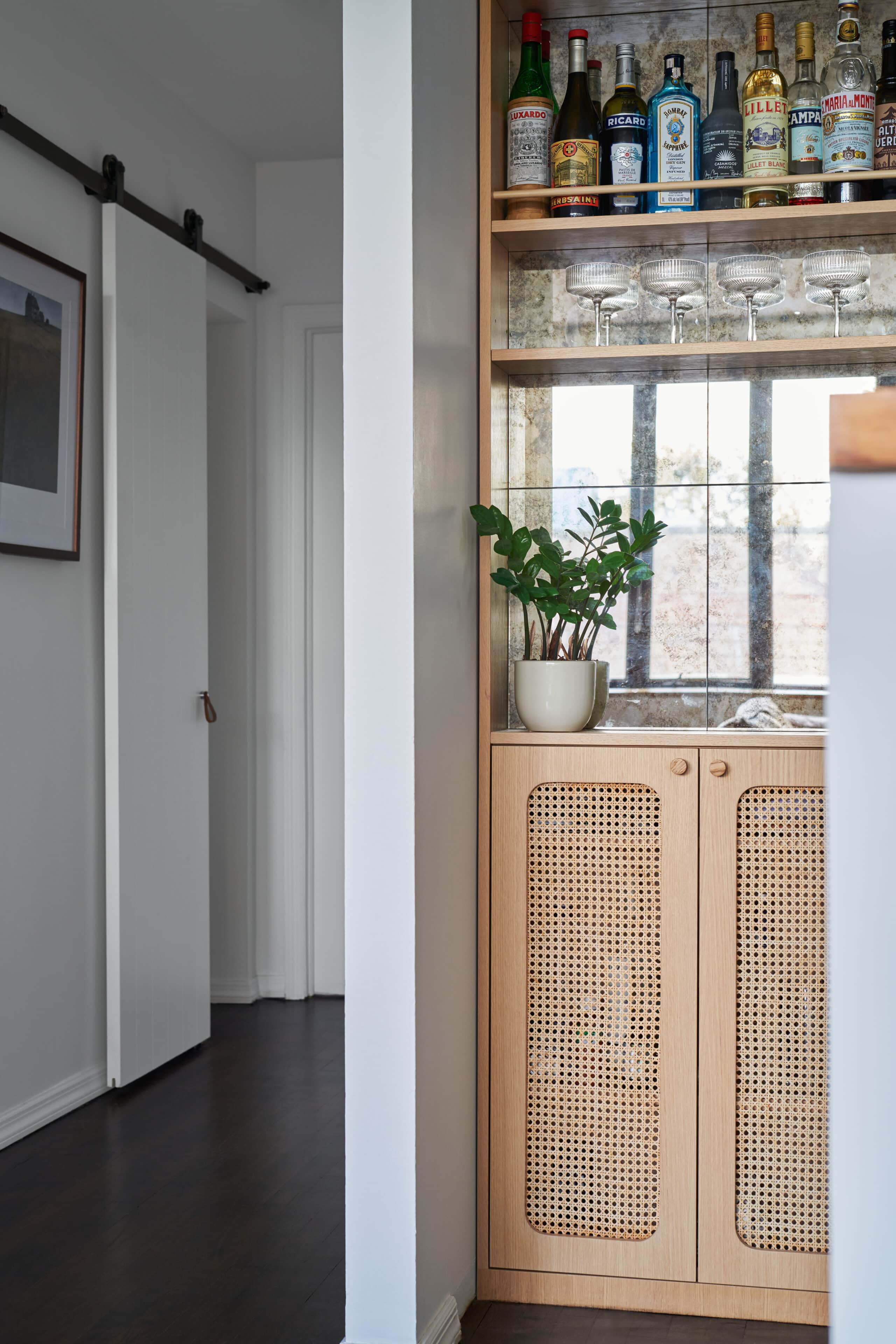 HALLWAY BUILT IN WITH CANE DOORS AND MIRROR